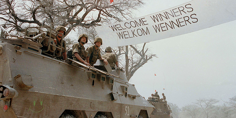 Cuban, South African, and Angolan members of the Joint Military Monitoring Commission cross a pontoon bridge at Rundu, South West Africa (modern-day Namibia), as the last South African troops move out of Angola on August 30, 1988.