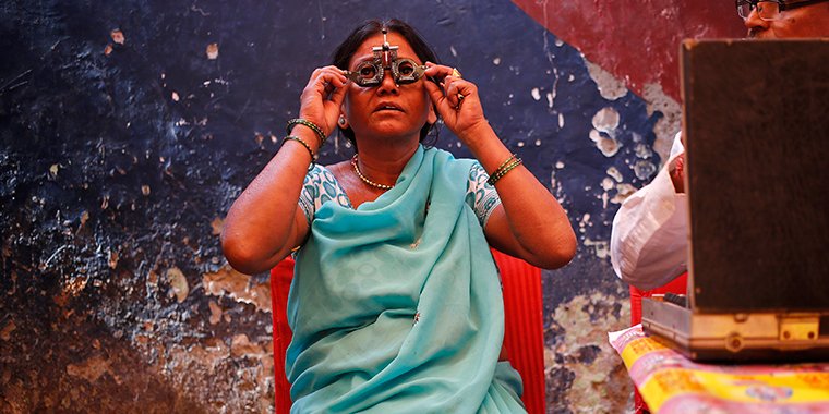 A woman undergoes an eye examination at a camp organised by a non-governmental organisation (NGO) in New Delhi November 18, 2013.