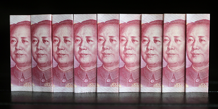 Chinese 100 yuan banknotes in Beijing on July 11, 2013. Investments from China usually come from state-owned companies and companies with close ties to the Chinese Communist Party.