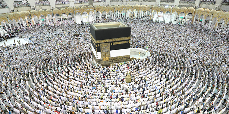 Muslim worshippers perform prayers around the Kaaba, Islam's holiest shrine, at the Grand Mosque in Saudi Arabia's holy city of Mecca on August 15, 2018, prior to the start of the annual Hajj pilgrimage in the holy city. 