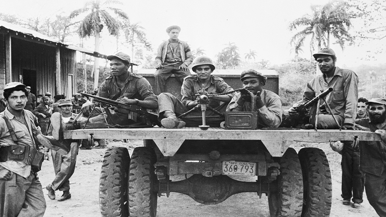 Members of Fidel Castro’s rebel column meet at an assembly point in the Sierra Maestra Cuba a few hours before a hit-and-run attack on a local government patrol post, April 2nd, 1958.