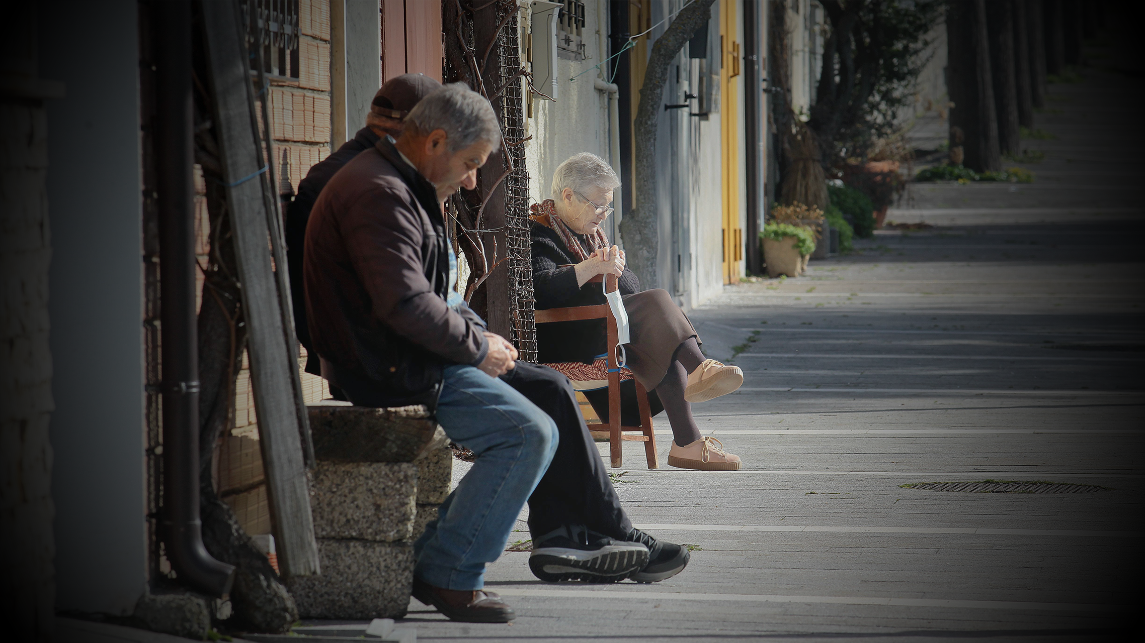 Maria Blumetti, one of the few female residents left, sits on a bench outside her home on February 19, 2021 in San Paolo Albanese (Potenza), southern Italy.