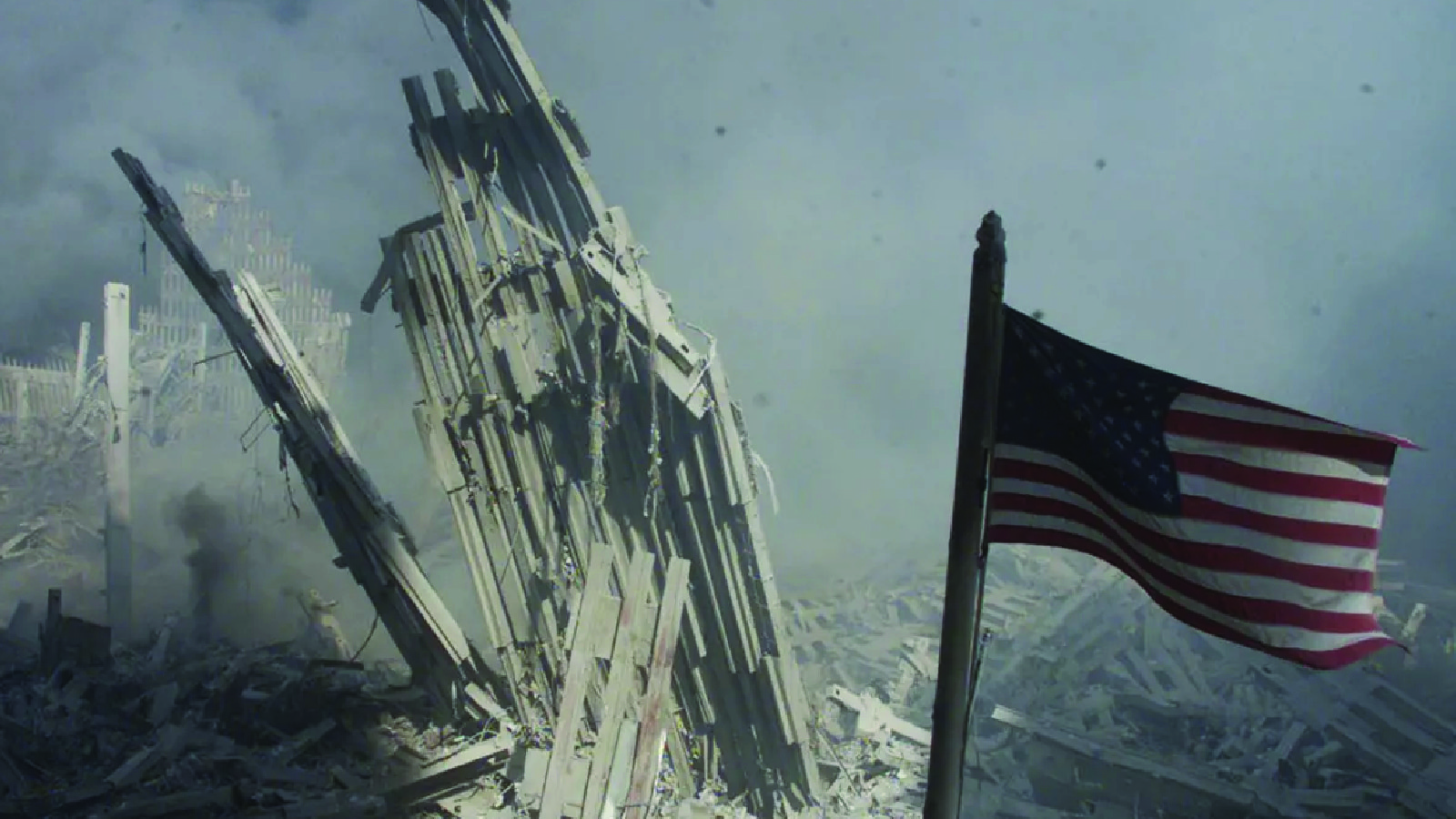 An American flag flies near the base of the destroyed World Trade Center in New York on September 11, 2001.