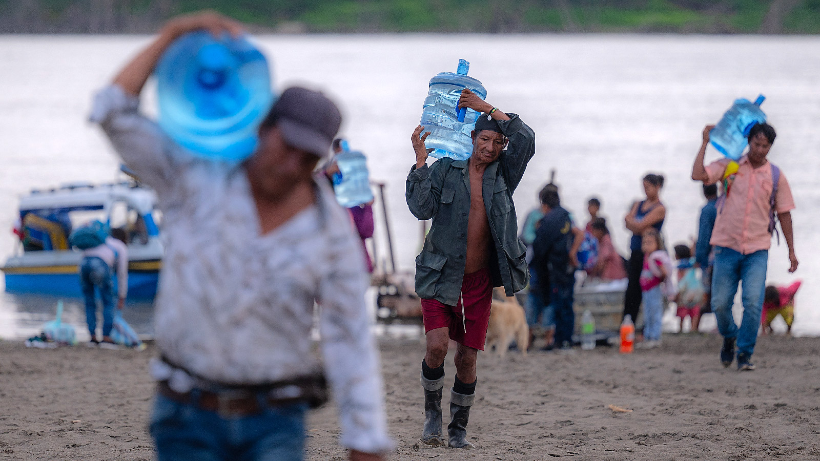 Severe drought of the Amazon River has forced Indigenous communities along its banks to struggle for essential resources. Yagua Indigenous people carry water supplies on Isla de los Micos, Colombia on October 4, 2024. 