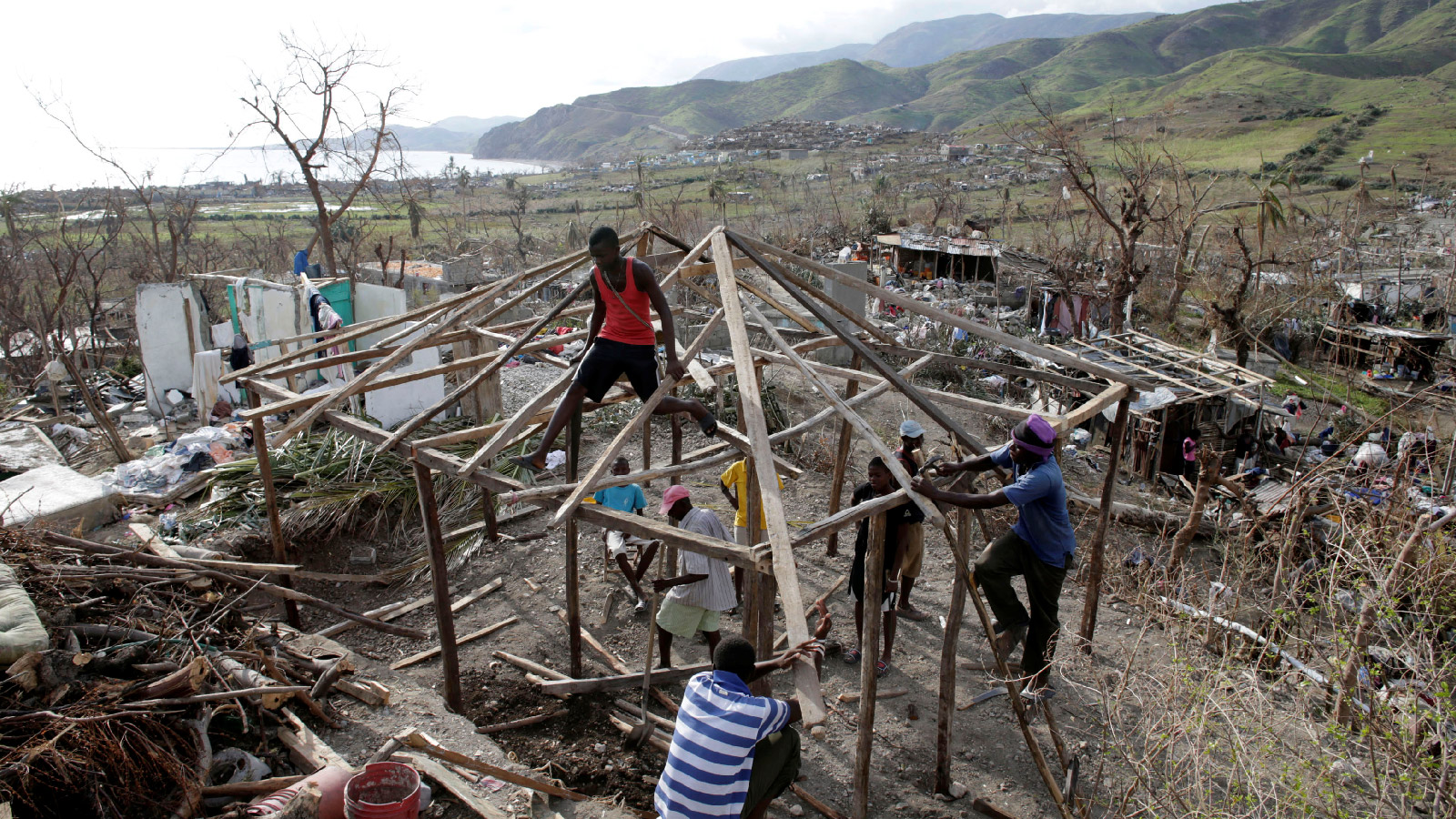 People work to rebuild a house destroyed by Hurricane Matthew in Les Anglais, Haiti on October 11, 2016. 