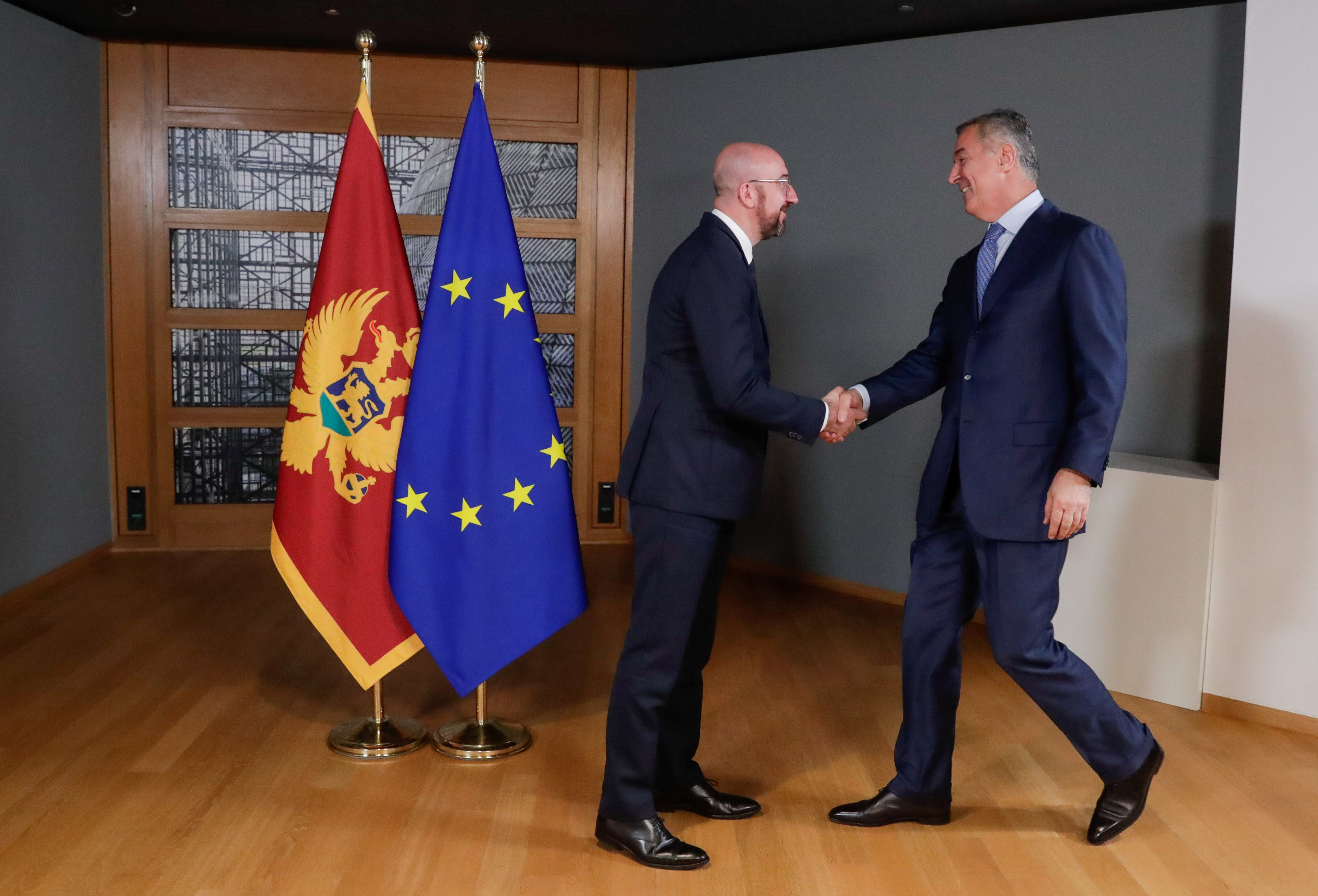 European Council President Charles Michel welcomes Montenegro's President Milo Dukanovic ahead of their meeting in Brussels, Belgium, February 17, 2020. 