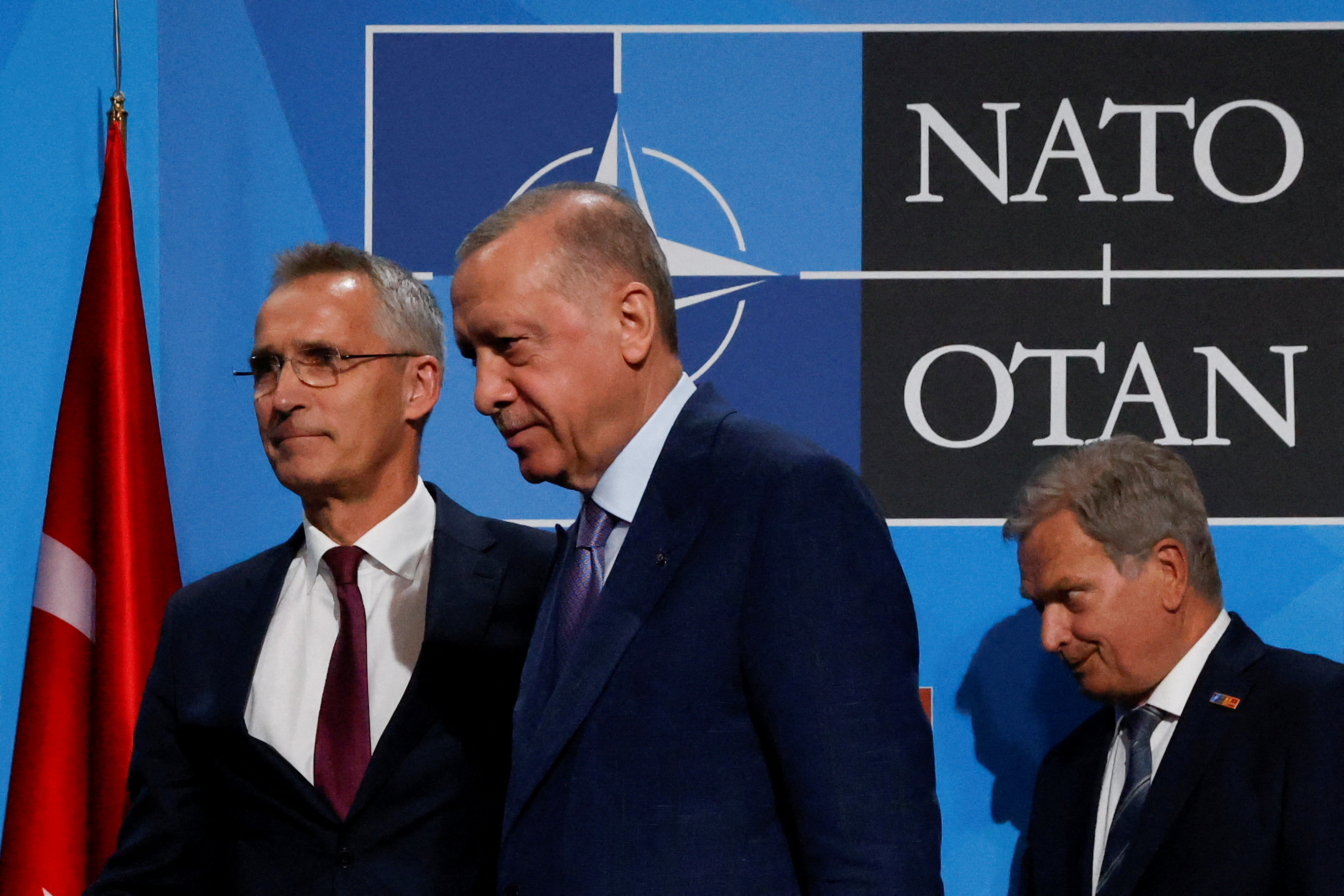 Turkish President Tayyip Erdogan, NATO Secretary General Jens Stoltenberg and Finland's President Sauli Niinisto leave after signing a document during a NATO summit in Madrid, Spain June 28, 2022. 