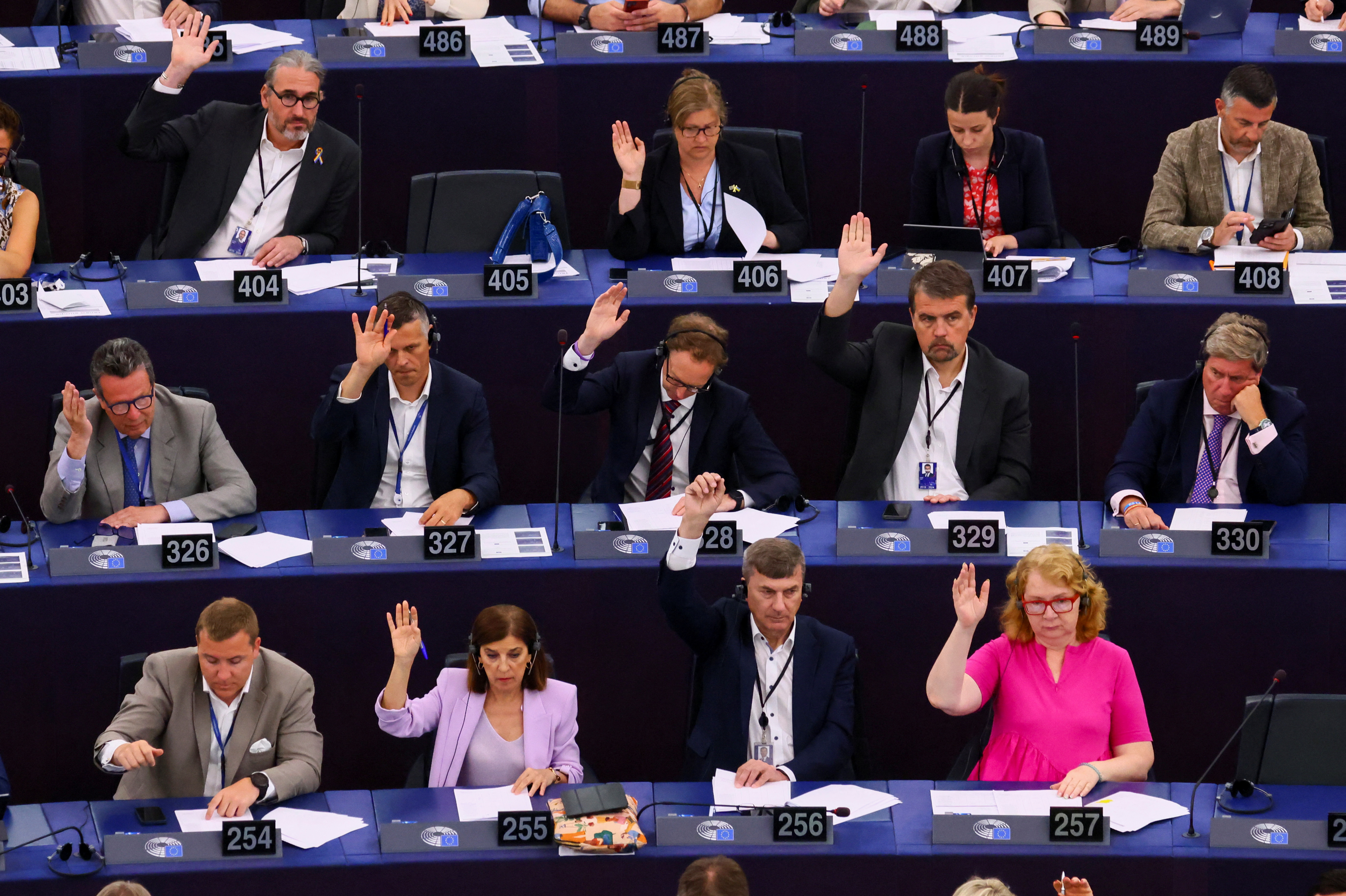 Members of the EU Parliament vote during a plenary session at the European Parliament in Starsbourg, France June 13, 2023.