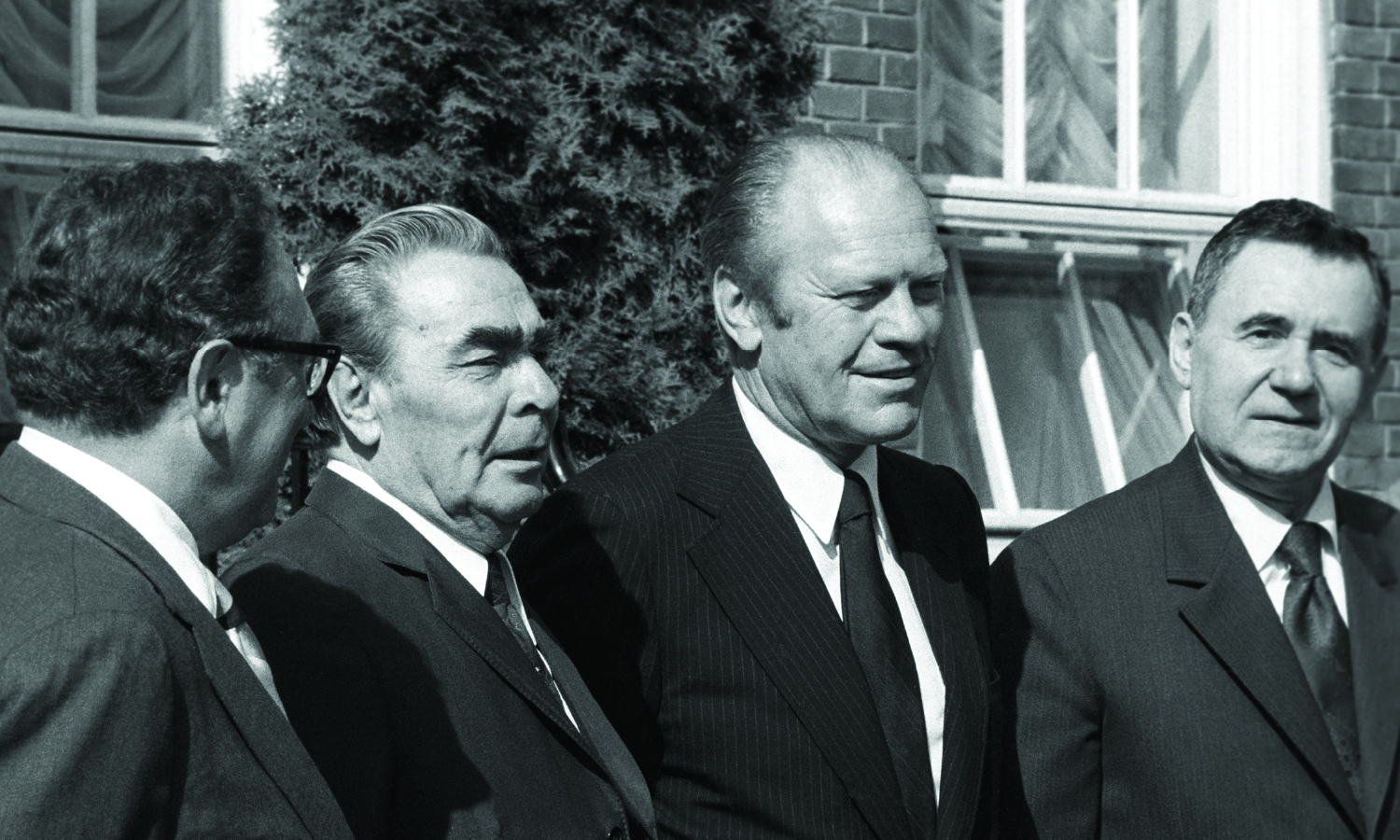 Soviet leader Leonid Brezhnev (center left) and U.S. President Gerald Ford stand outside before the start of the Conference on Security and Cooperation in Europe in Helsinki, Finland on July 14, 1957.