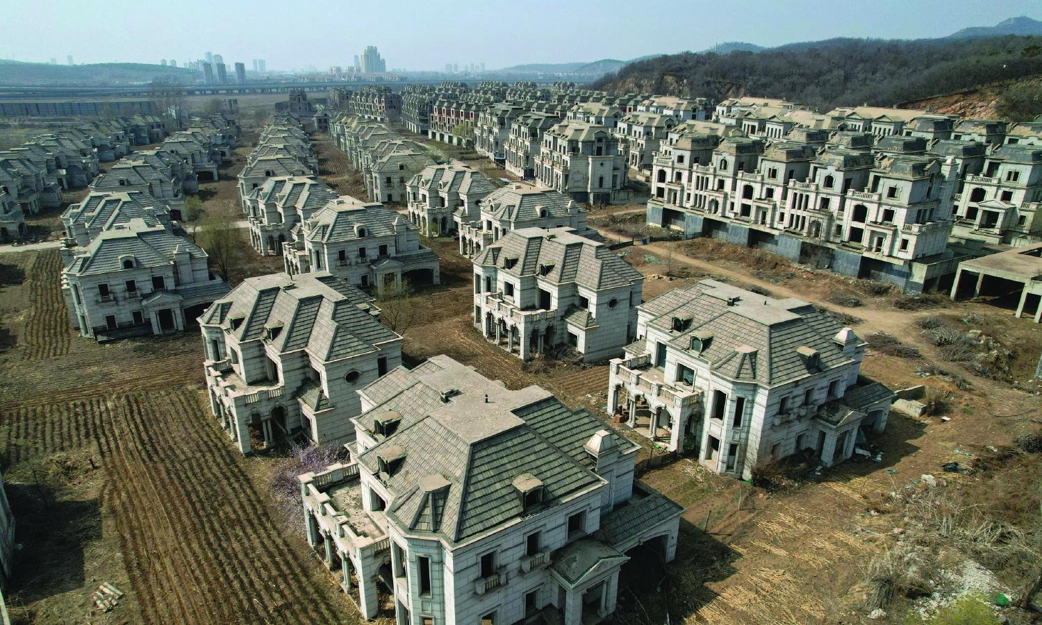 Deserted villas reflect the rapid, unchecked growth of the real estate industry in many areas, in a suburb of Shenyang, China, on March 31, 2023.