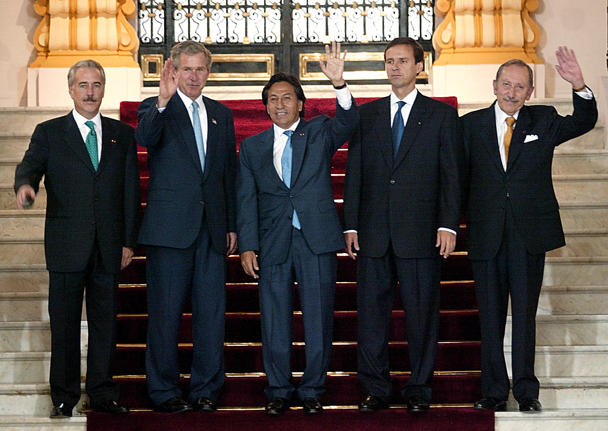Presidents pose and wave at Andean Trade Preference Act meeting.