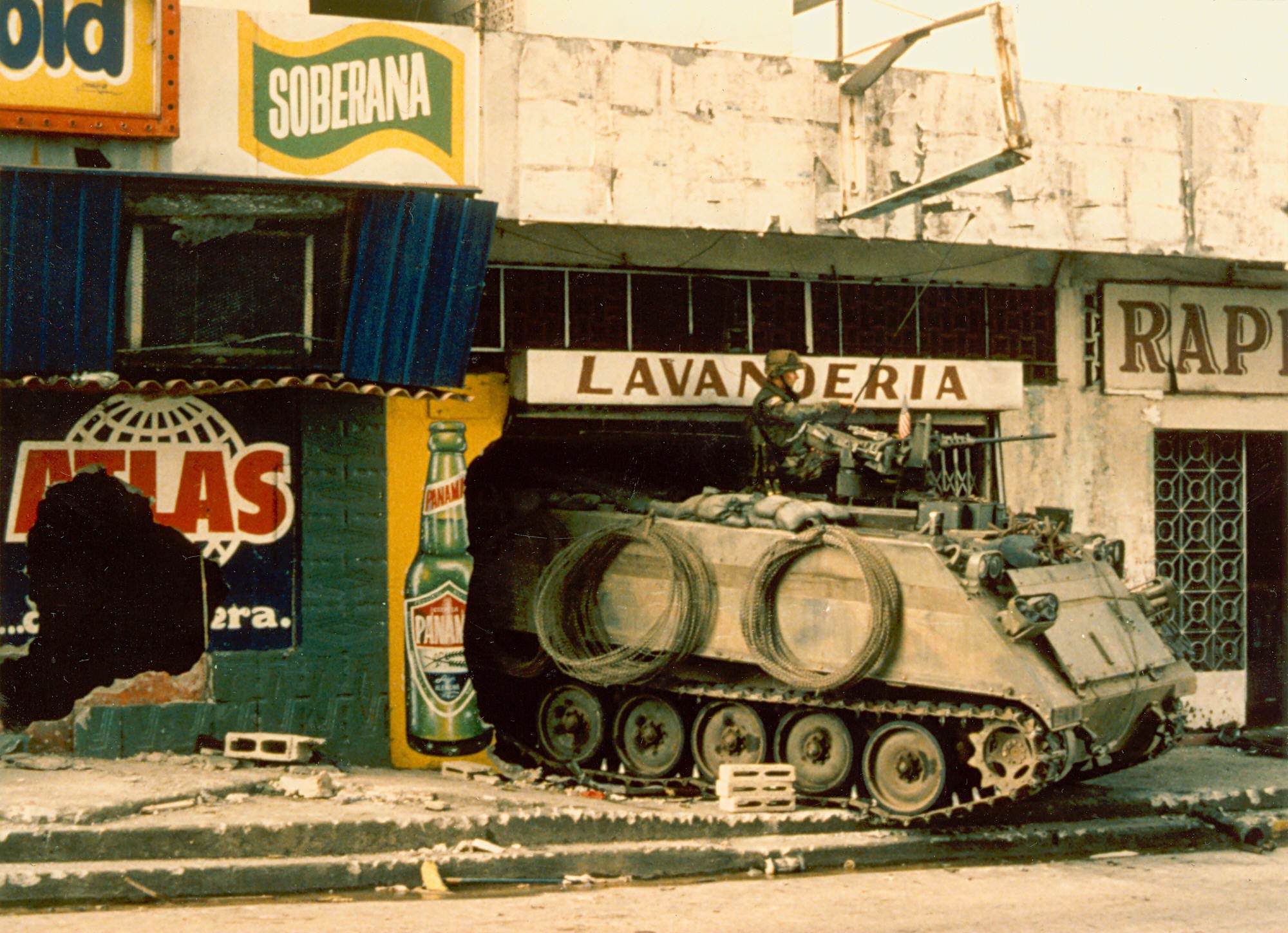 A U. S. armored M-113 personnel carrier finds shelter in a Panama City laundromat.