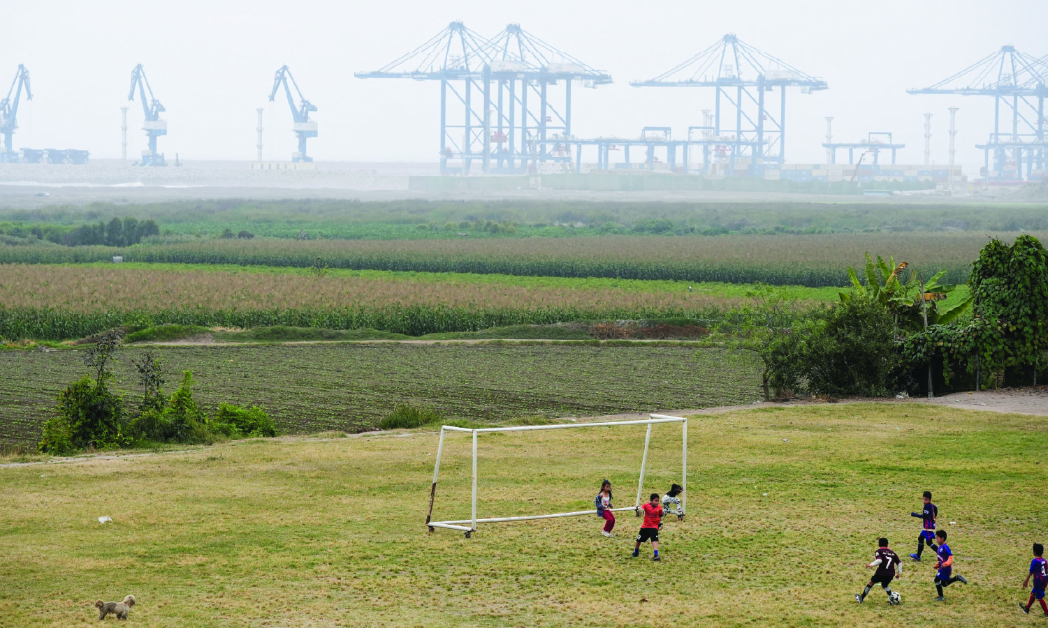 Children play football near the new megaport being built by China's state-owned Cosco Shipping in Chancay, Peru October 24, 2024. 