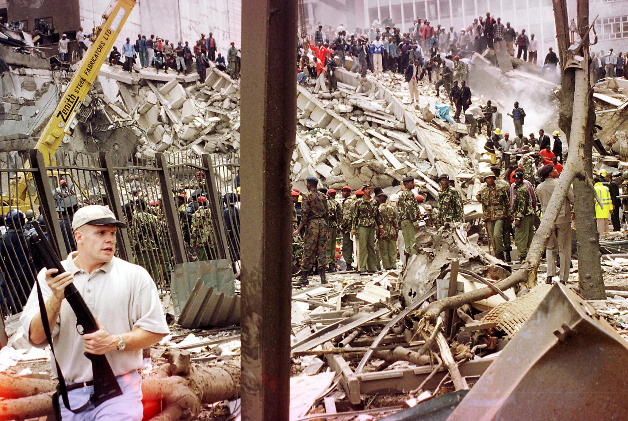 Rescuers work to help survivors amid the rubble and devastation brought in by a bomb explosion near the US embassy and a bank in Nairobi, Kenya.