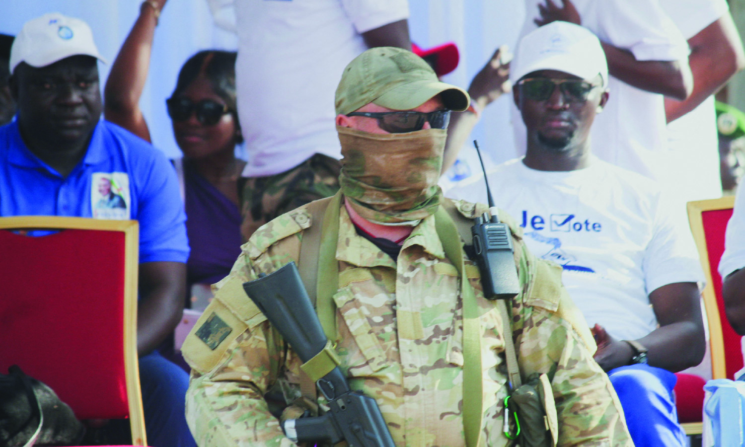 A Russian officer, with his face covered, from the Wagner group stands guard as he takes part in the Central African president Faustin-Archange Touadera's security system.
