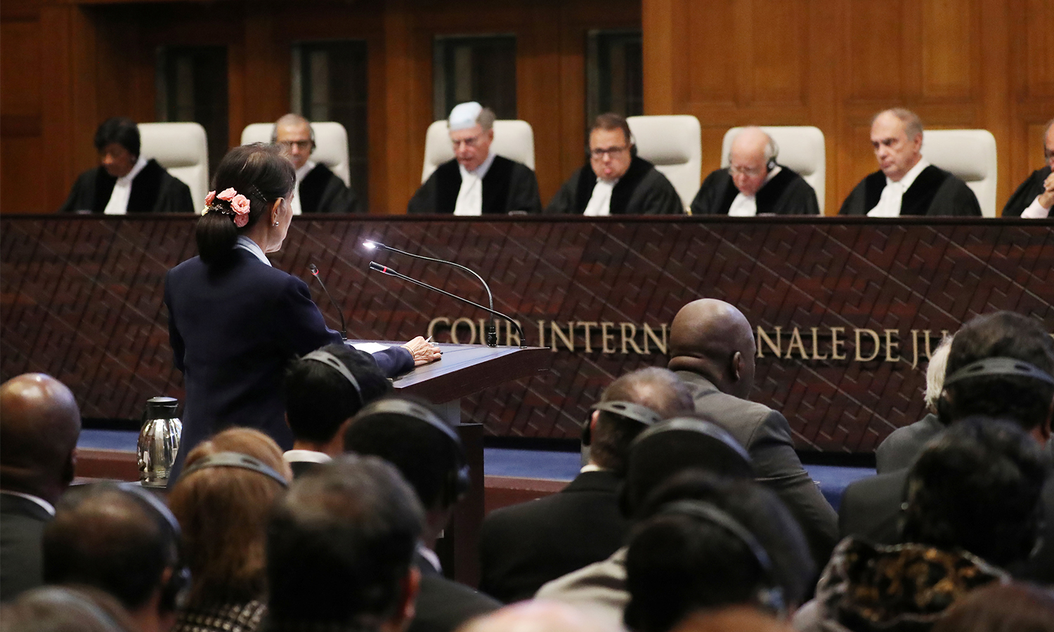 Myanmar's leader Aung San Suu Kyi speaks to judges during a hearing in a case at the ICJ.