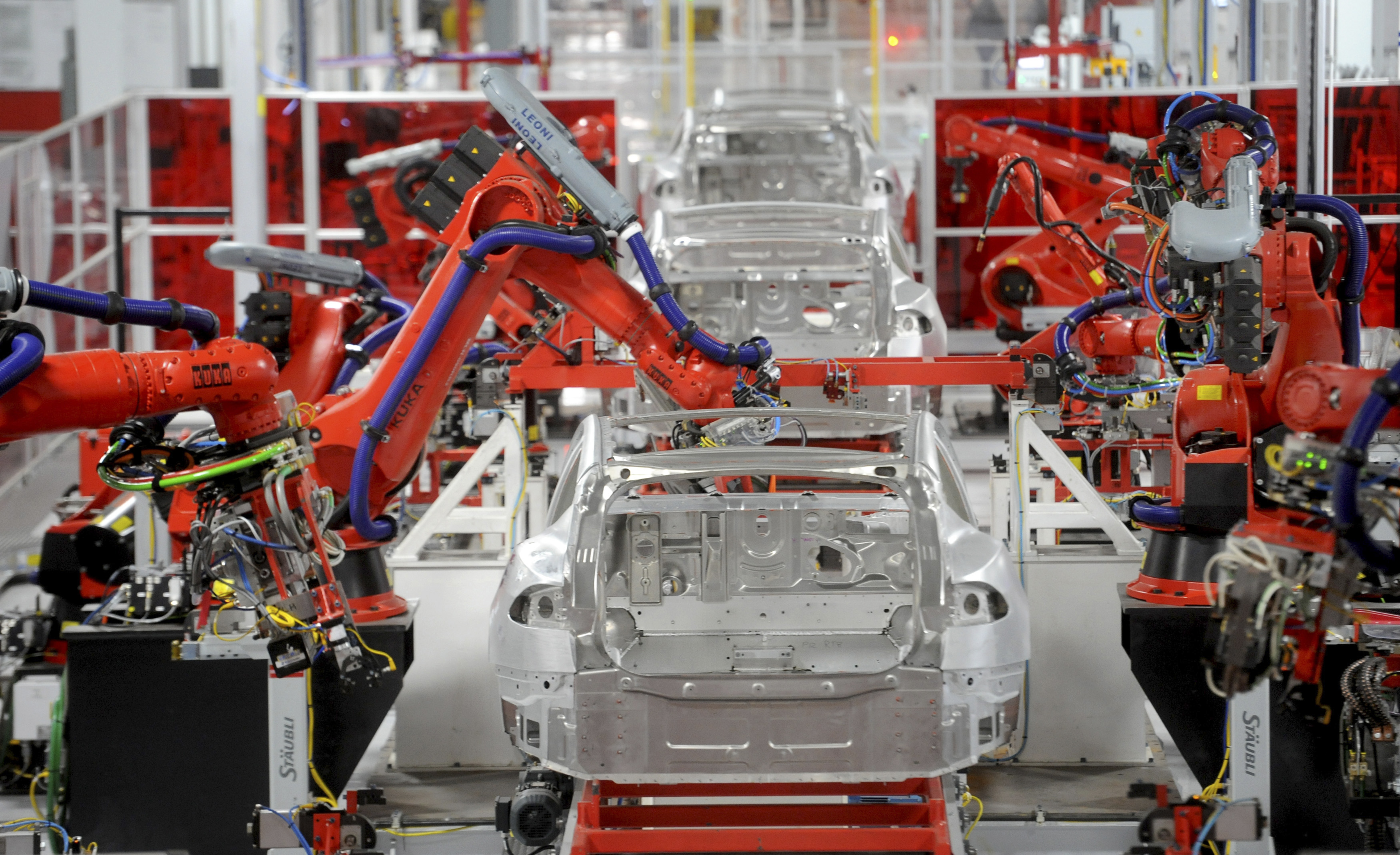 Robotic arms assemble Tesla's Model S sedans at the company's factory in Fremont, California, on June 22, 2012. Source: Noah Berger/Reuters.
