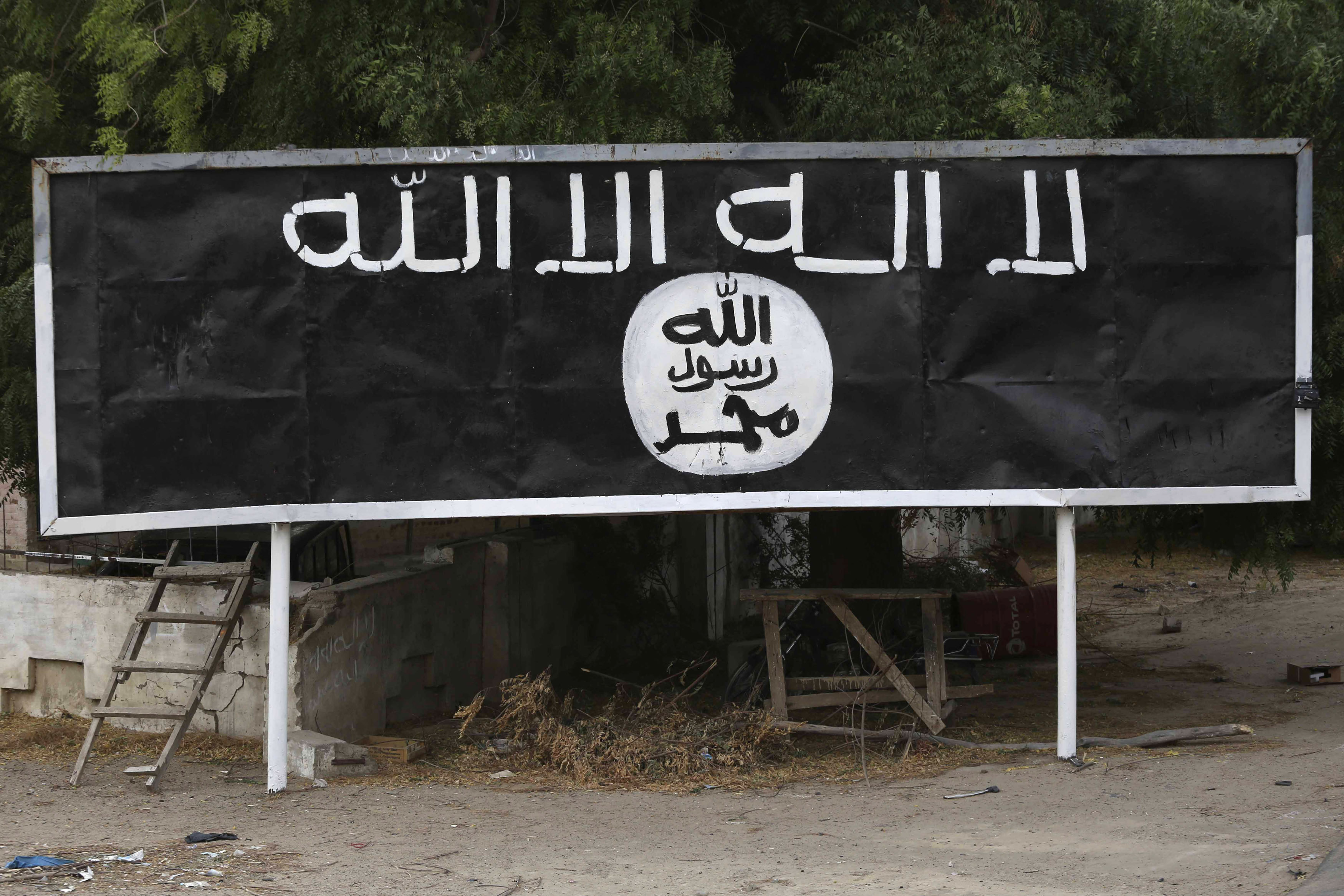 A signpost painted by Boko Haram is seen in the recently retaken town of Damasak, Nigeria, on March 18, 2015. Source: Emmanuel Braun/Reuters.