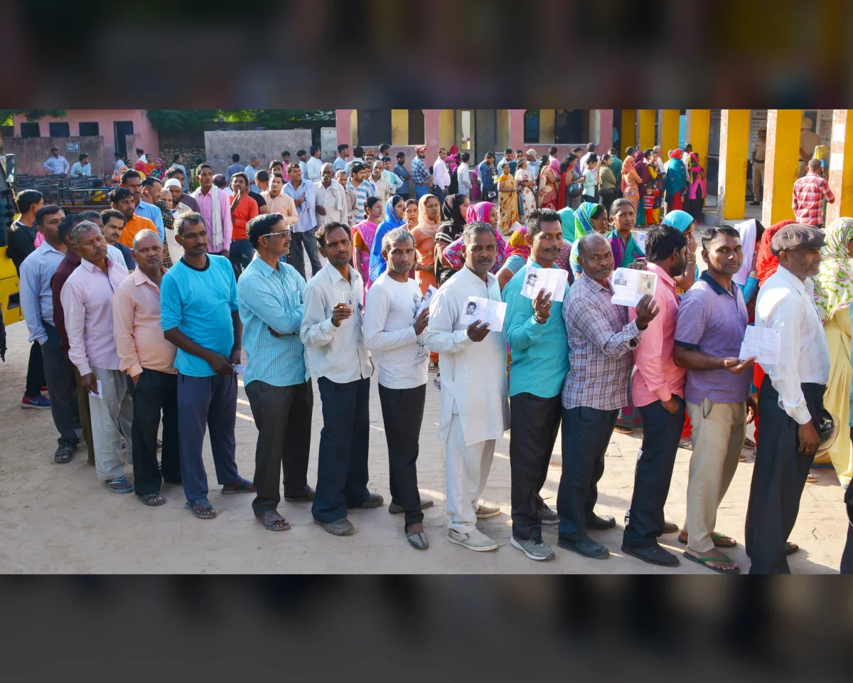 A photo showing Indian voters waiting to cast their ballots at the polls for assembly elections on October 21, 2019, in Panchkula, India.