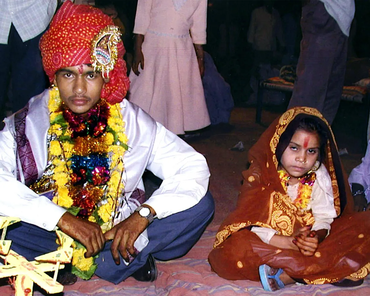 A photo showing a 16-year-old boy preparing to marry a young girl in Indore, India, on May 15, 2002, despite a government ban on under-age nuptials.