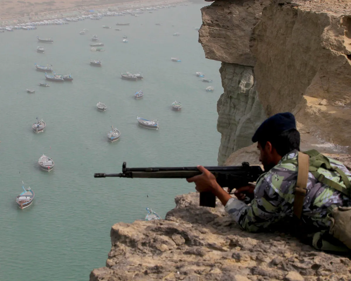 A photo showing Iranian military personnel practicing at location near the Strait of Hormuz in southern Iran on December 30, 2011.