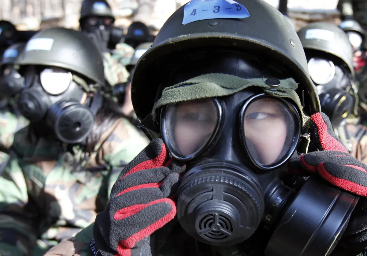 Close-up image of student with gas mask on.