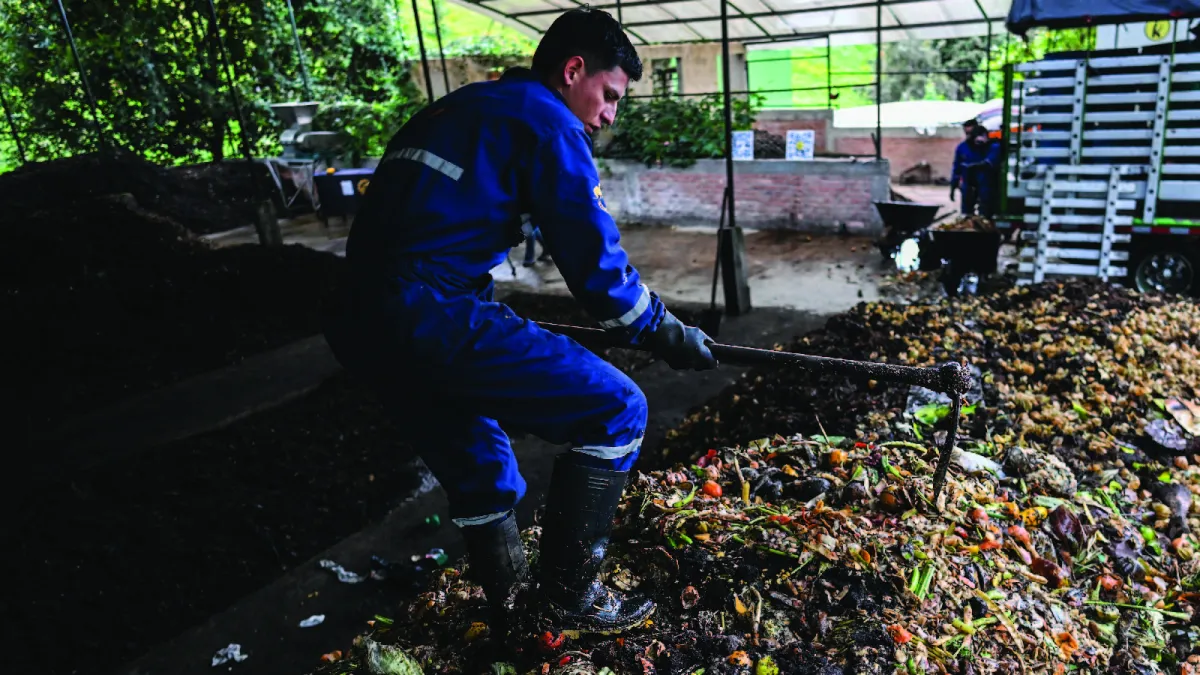 Employees collect organic waste at Tierra Viva farm in Tunja, Colombia, on July 18, 2024.