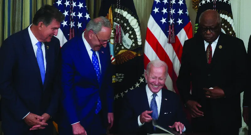 President Joe Biden smiles as he signs "The Inflation Reduction Act of 2022 into law during a ceremony at the White House on August 16, 2022.