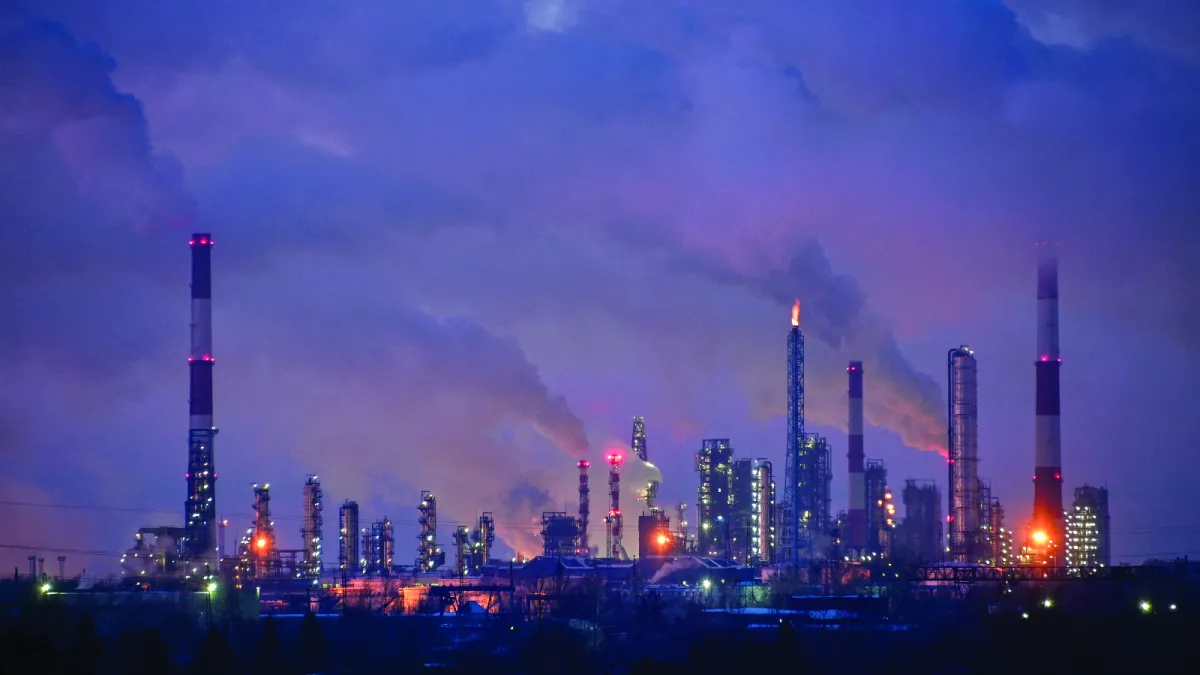 Gas and steam rise out of smokestacks at an oil refinery in Omsk, Russia