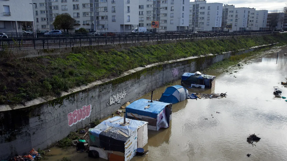 Following heavy rains, slums on the Garonne riverbanks were flooded, forcing evacuations in Toulouse, France, on December 14, 2019. 