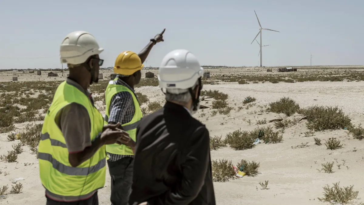 Technical managers discuss operations at a wind farm plant that is helping advance Mauritania’s goal of reaching half renewable energy by 2030 in Nouakchott, Mauritania