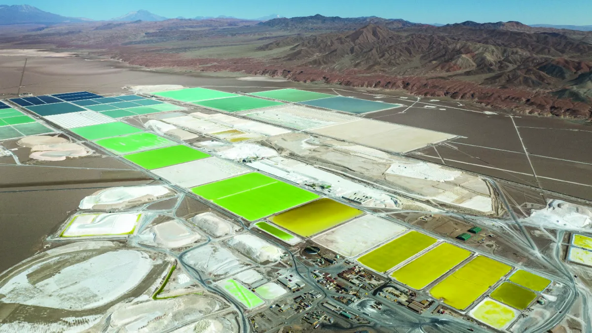 An aerial view of pools of brine containing lithium carbonate and mounds of salt by-product in a lithium mine in Salar de Atacama, Chile, on August 24, 2022.