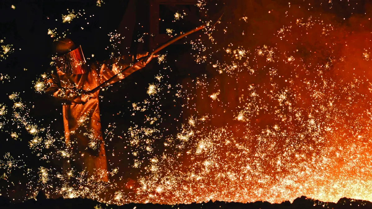  A steelworker at a furnace at a steel company plant in Salzgitter, Germany on March 17, 2015. 