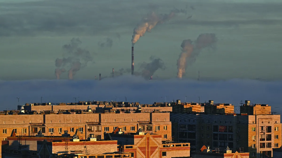 Steam rises from the chimneys of a thermal power plant and an oil refinery in Omsk, Russia October 14, 2024.