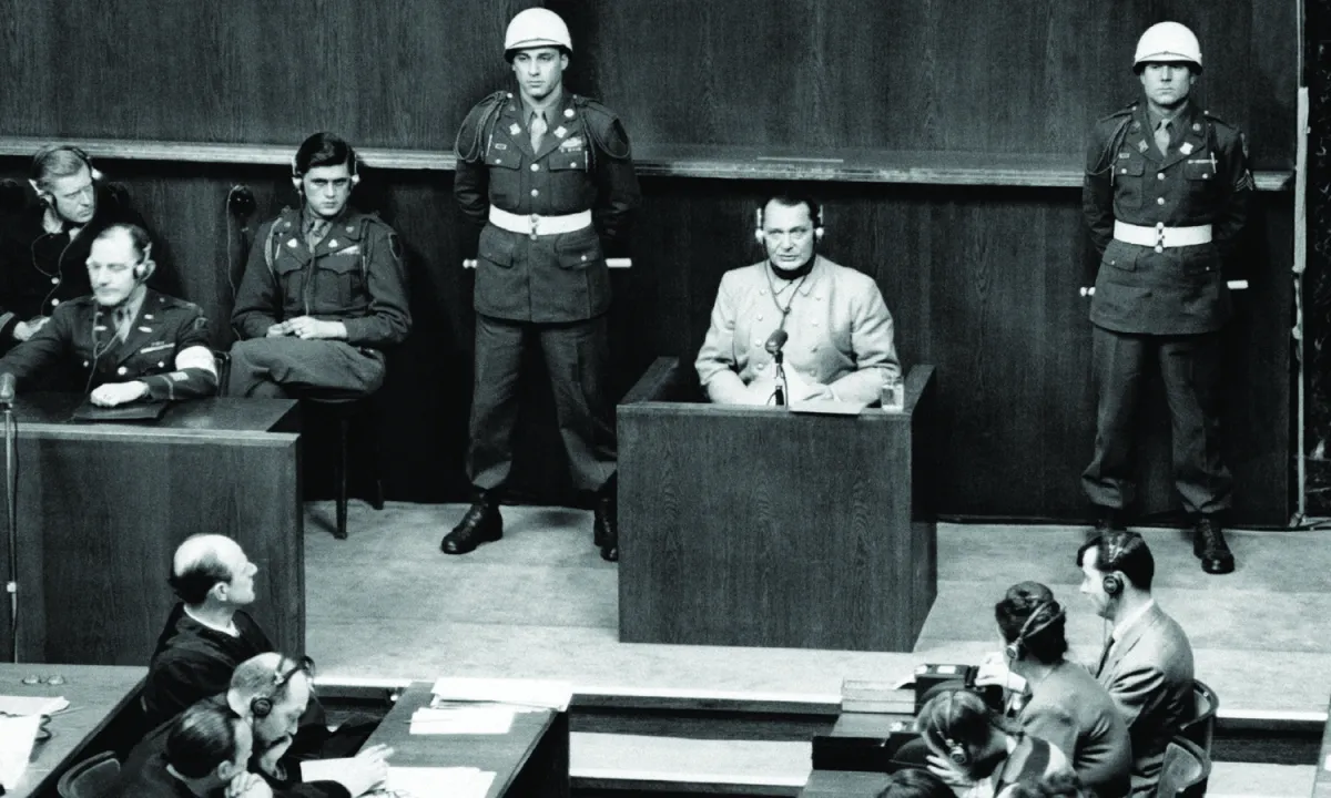 Nazi leader Hermann Goering sits in the defendent box accused of crimes against humanity, among other charges, at the Nuremberg Trials in Germany on March 16, 1946.