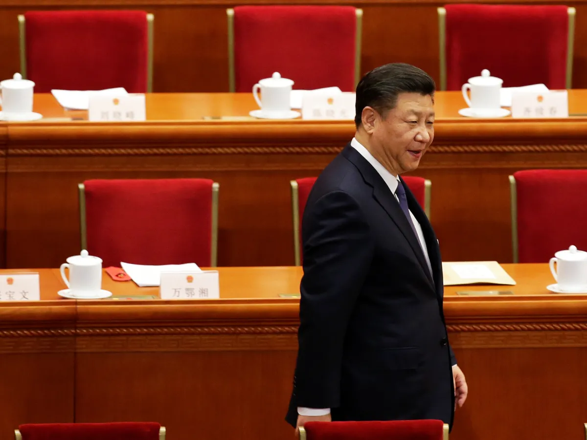 An image of Chinese President Xi Jinping arriving at a National People's Congress session in Beijing where delegates voted on a constitutional amendment lifting presidential term limits.