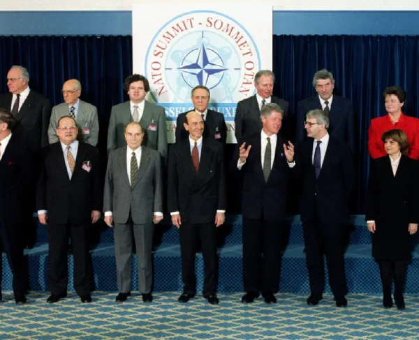Heads of state and NATO Secretary General Manfred Woerner (center) pose for photographers at the NATO summit in Brussels on January 10, 1994.