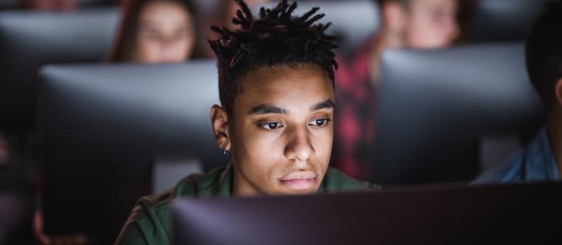 Student looking at a computer screen