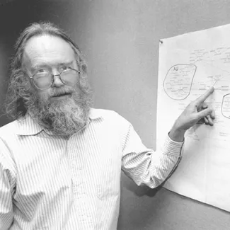 Jon Postel, director of the Internet Assigned Numbers Authority, with a hand-drawn map of Internet top-level domains in 1994. Postel submitted the proposal for the Internet Corporation for Assigned Names and Numbers (ICANN) just prior to his death in 1998.