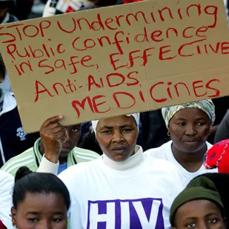 AIDS activists protest outside the U.S. consulate in Cape Town, South Africa, on June 24, 2004.