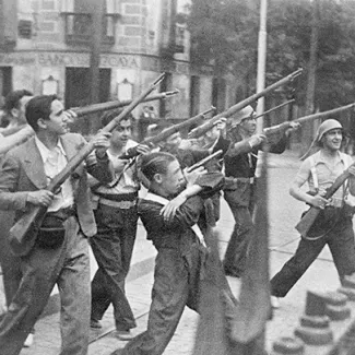 Republicans fight in a street of an unidentified town against nationalist rebels in 1936 during the Spanish Civil War. 
