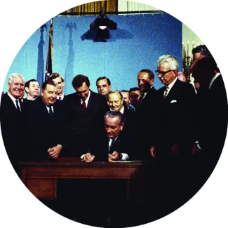 President Lyndon B. Johnson signs the Clean Air Act at the White House on November 21, 1967.