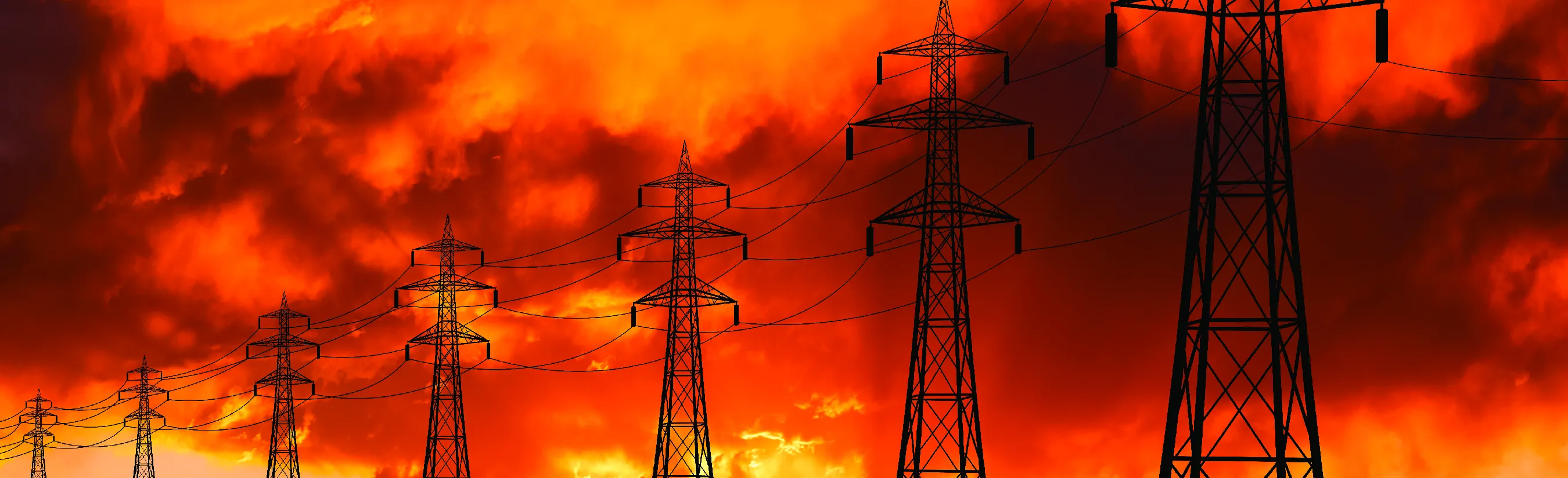 High voltage towers at sunset background. Power lines against the sky