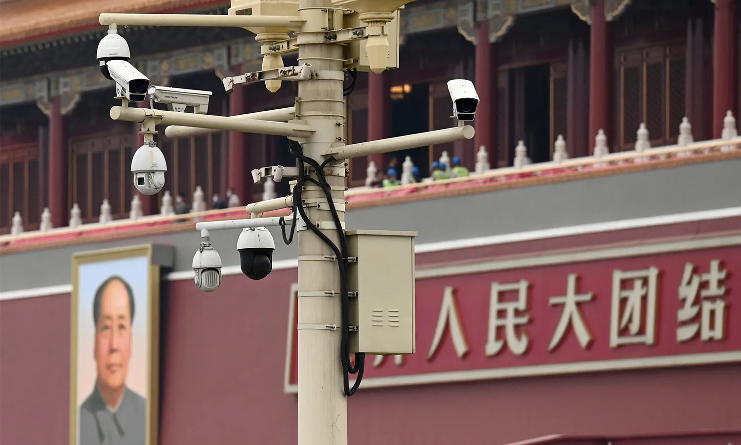 A closed-circuit camera is seen in front of a portrait of Mao Zedong at the Tiananmen Gate on June 24, 2021.